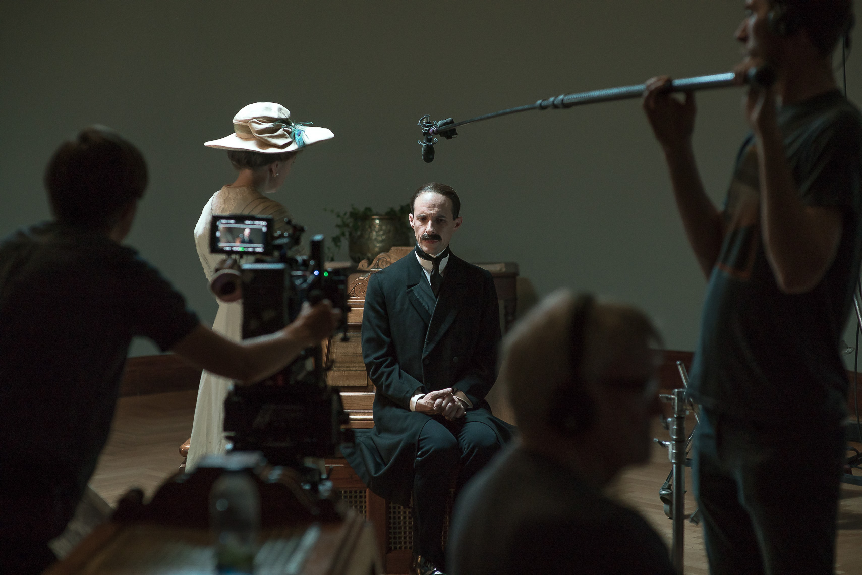 Lesley Conroy as Ms Sarah Cecilia Harrison and Tom Vaughan-Lawlor as Hugh Lane surrounded by film crew.
